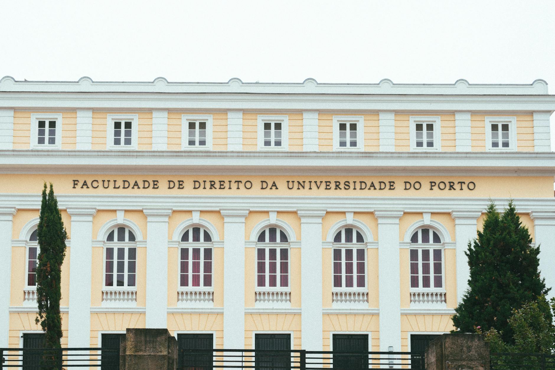 a building with a large sign that says university of porto